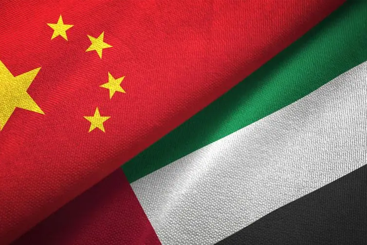 United Arab Emirates and China flag together realtions textile cloth fabric texture. Image used for illustrative purpose. Getty Images