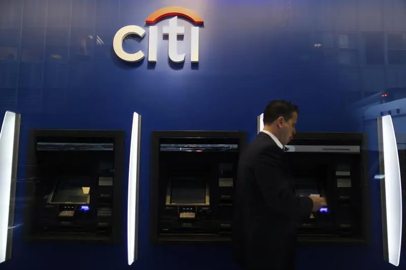 A man walks past a Citibank branch in lower Manhattan, New York October 16, 2012. REUTERS/Carlo Allegri