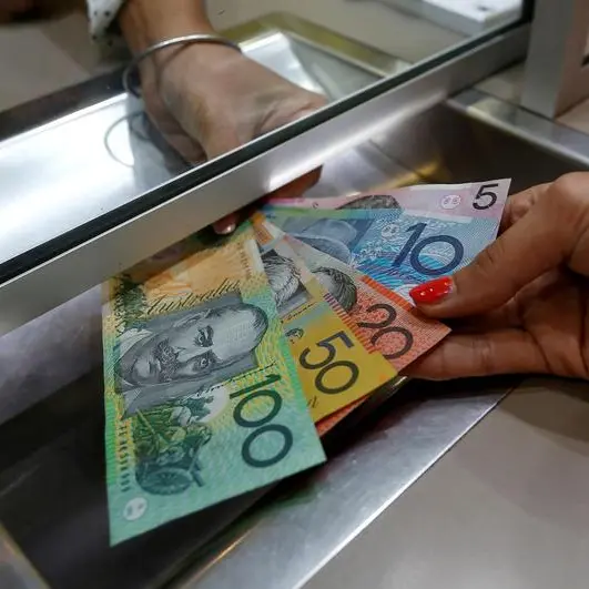 Australia, NZ dollars dip on soft China data, set for weekly gains