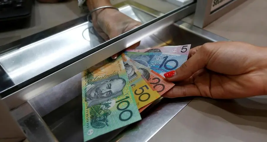 Australia, NZ dollars dip on soft China data, set for weekly gains