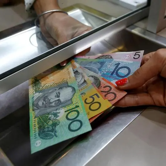 Australian dollar gains on rate hike jitters, yen selling