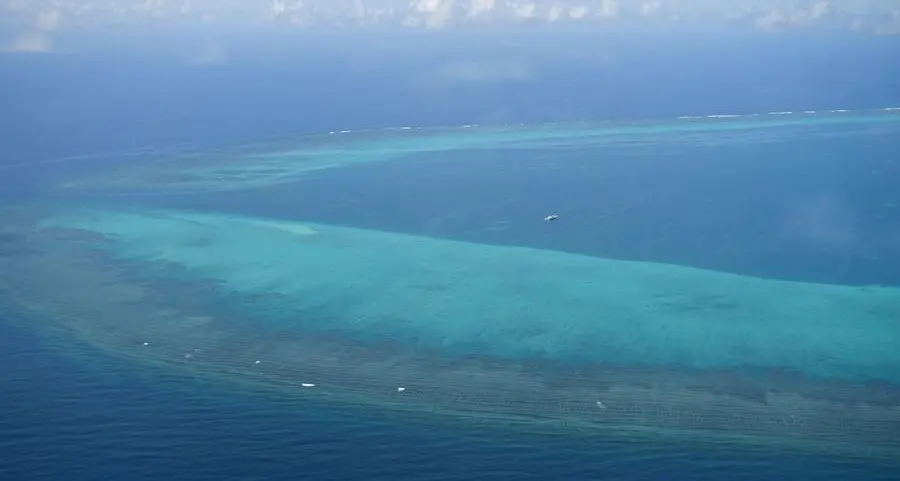 Philippines vows to remove future barriers at disputed reef