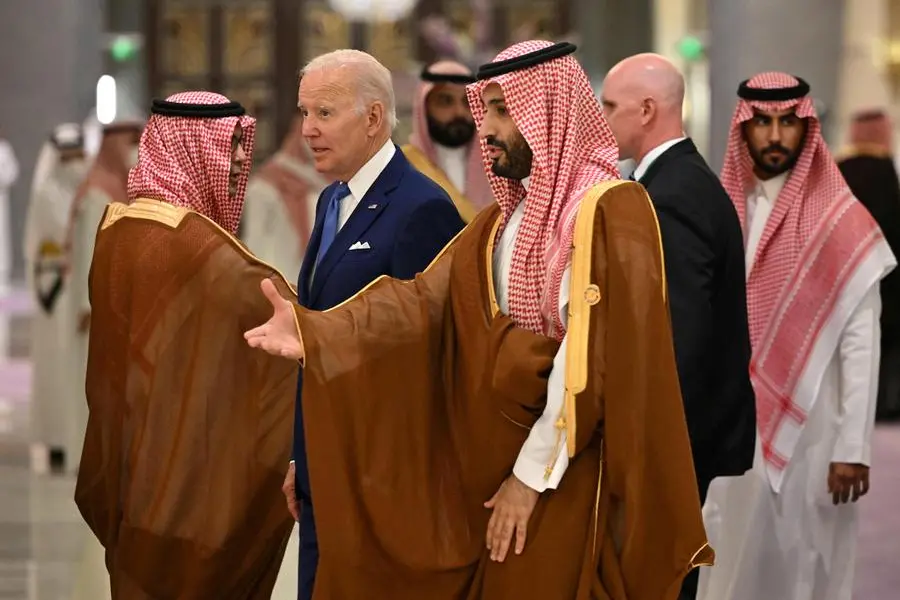 U.S. President Joe Biden and Saudi Crown Prince Mohammed bin Salman arrive for the family photo during the \"GCC+3\" (Gulf Cooperation Council) meeting at a hotel in Jeddah, Saudi Arabia July 16, 2022. Mandel Ngan/Pool via REUTERS