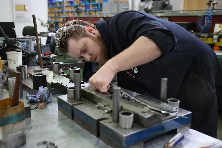A worker in Brandauer\\'s factory processes new orders as they benefit from the reshoring of manufacturing following global supply chain disruption in Birmingham, Britain, July 28, 2022. REUTERS/Molly Darlington Image used for illustrative purpose. , Reuters