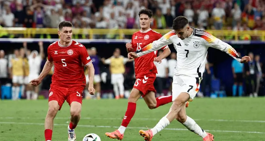 Euro hosts Germany pass Denmark test but clouds remain