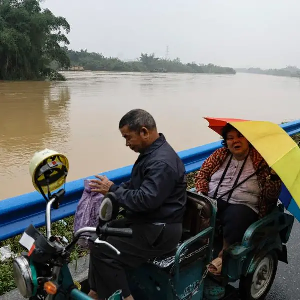 Rescuers race to those trapped by unseasonal floods in China's Guangdong