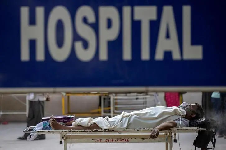 A patient suffering from the coronavirus disease (COVID-19) waits to get admitted outside the casualty ward at Guru Teg Bahadur hospital, amidst the spread of the disease in New Delhi, India, April 23, 2021. REUTERS/Danish Siddiqui , Reuters Images/REUTERS