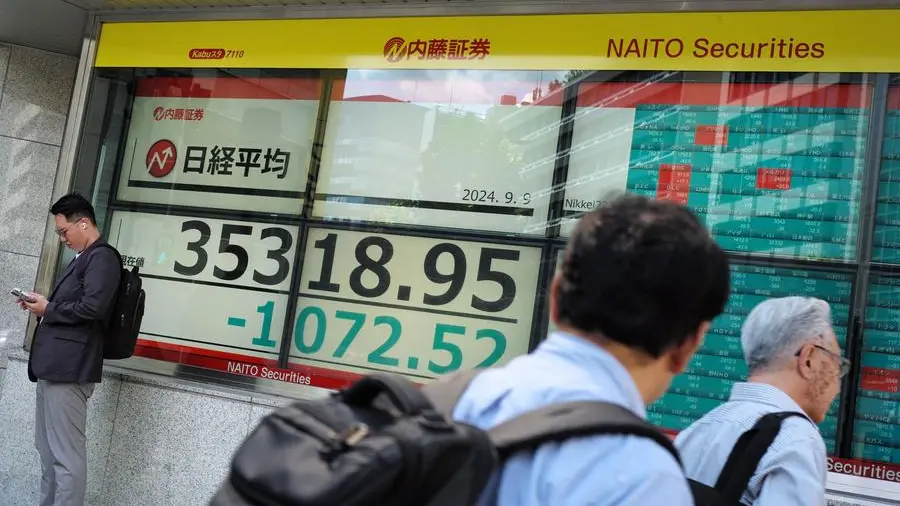 Asian markets fluctuate at end of tough week