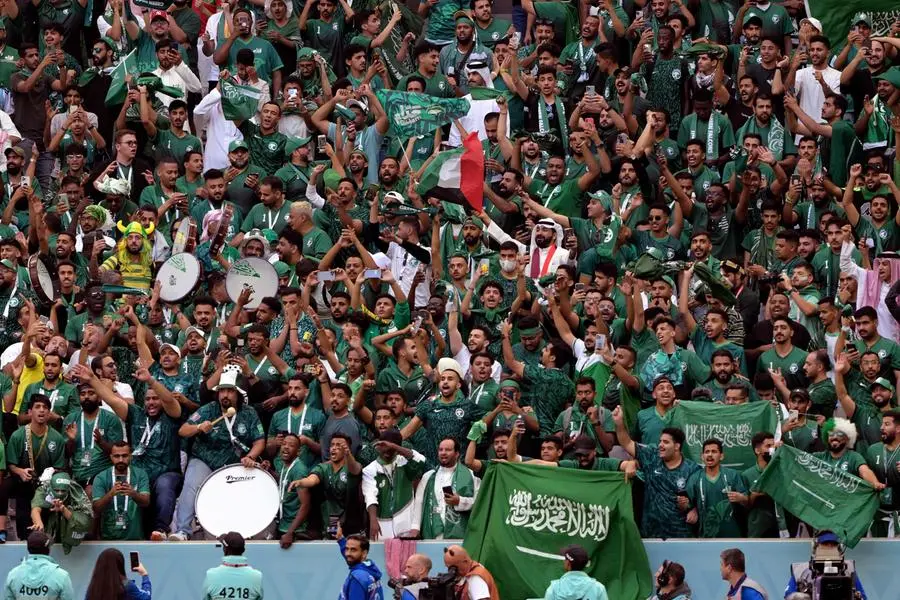Supporters cheer during the Qatar 2022 World Cup Group C football match between Argentina and Saudi Arabia at the Lusail Stadium in Lusail, north of Doha on November 22, 2022. (Photo by JUAN MABROMATA / AFP)