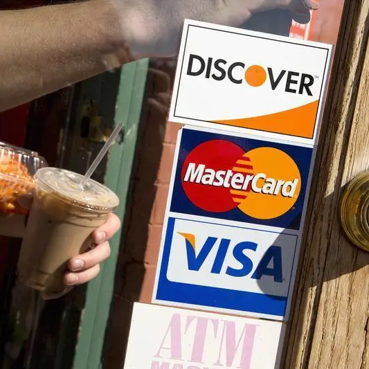 US banks to see modest hit from deal to lower swipe fee by Visa, Mastercard