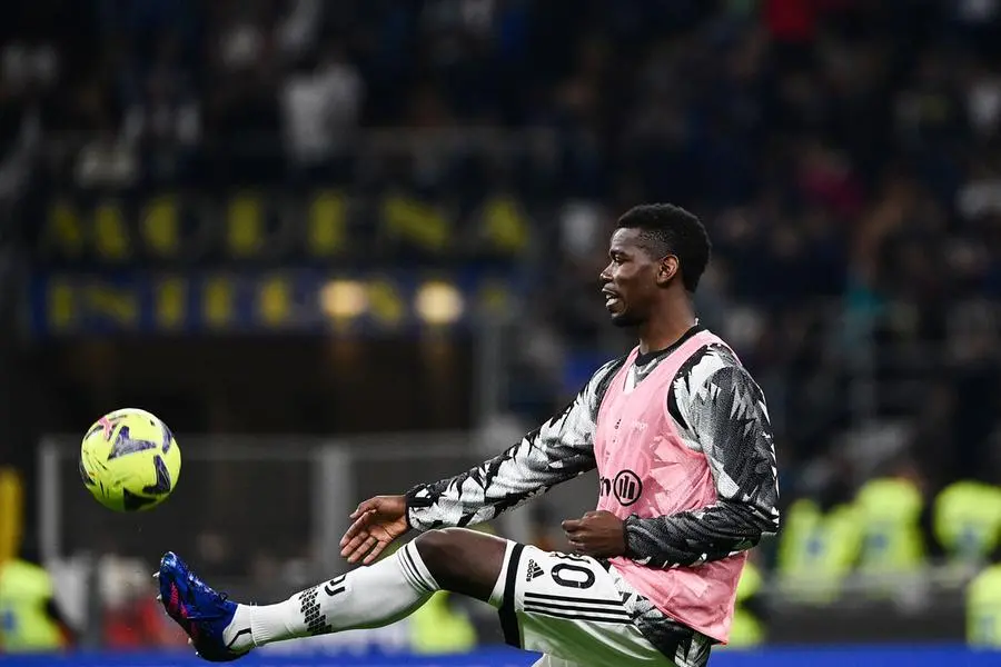 (FILES) Juventus\\' French midfielder Paul Pogba warms up during the Italian Cup semi-final second leg football match between Inter Milan and Juventus at the Giuseppe-Meazza (San Siro) stadium in Milan, on April 26, 2023. After a nightmare season in 2022-2023 plagued by injuries and off-field problems, Juventus\\' midfielder Paul Pogba has no time to lose after six years of ups and downs at Manchester United (2016-22). (Photo by Isabella BONOTTO / AFP) , Agence France-Presse (AFP)/AFP