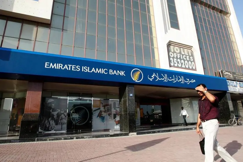 A man walks past a branch of Emirates Islamic Bank along Khalid Bin Al-Waleed Road in Dubai. Mosab Omar, Reuters , Reuters Images
