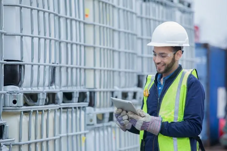 Image used for illustrative purpose. Engineer checks shipment of chemicals at oil and gas industry pipeline job site. , Getty Images
