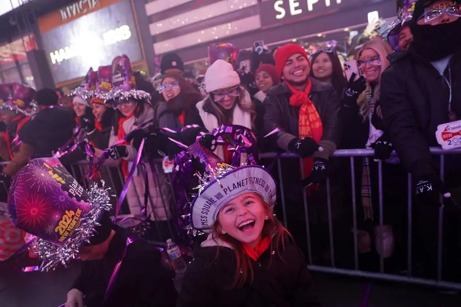 Revellers gather in Times Square during the celebrations of New Year's Eve, in New York City, New York, U.S., December 31, 2023. REUTERS/Jeenah Moon