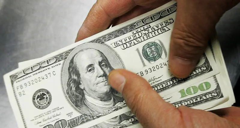 Dollar headed for second weekly gain as rate cut optimism cools