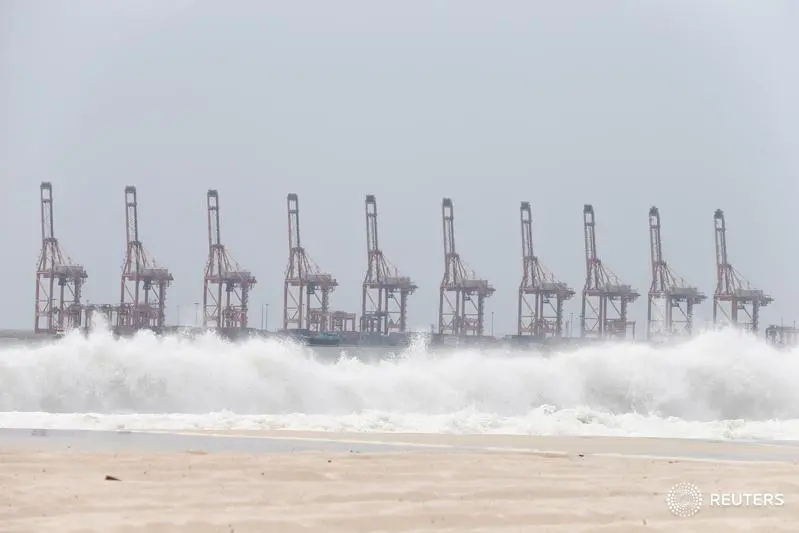 Sea waves are seen intensifying off the beach of a local hotel, as Salalah Port is seen behind, ahead of Cyclone Luban, which is expected to hit Salalah, Oman, October 11, 2018. REUTERS/Stringer