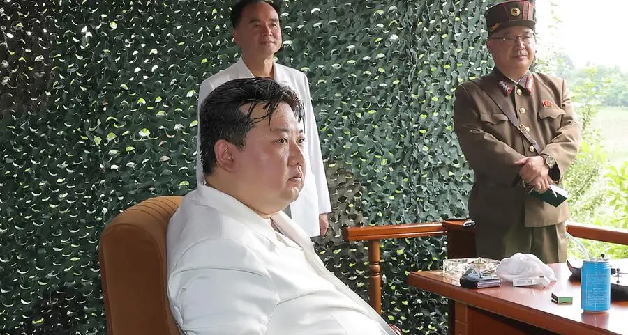 North Korea's Kim pictured with foldable smartphone at ICBM launch