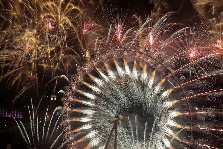 A view of fireworks over the London Eye to mark the New Year's celebrations, in London, Britain, January 1, 2024. REUTERS/Hollie Adams