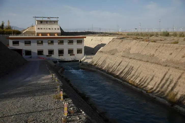 Image used for illustrative purpose. A hydropower station stands on the Changma river on the outskirts of Yumen, Gansu province, China, September 28, 2020. REUTERS/Carlos Garcia Rawlins