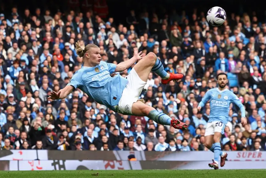 Manchester City\\'s Norwegian striker #09 Erling Haaland fails to connect with the ball during this attempt during the English Premier League football match between Manchester City and Wolverhampton Wanderers at the Etihad Stadium in Manchester, north west England, on May 4, 2024. (Photo by Darren Staples / AFP)