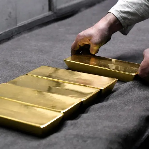 Gold flirts with record highs ahead of US data