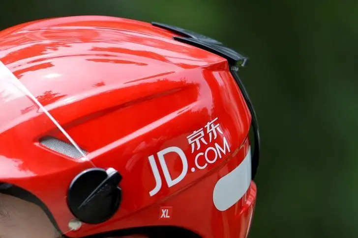 A logo of JD.com is seen on a helmet of a delivery man in Beijing, China June 16, 2014. Picture taken June 16, 2014. Jason Lee, Reuters , Reuters Images