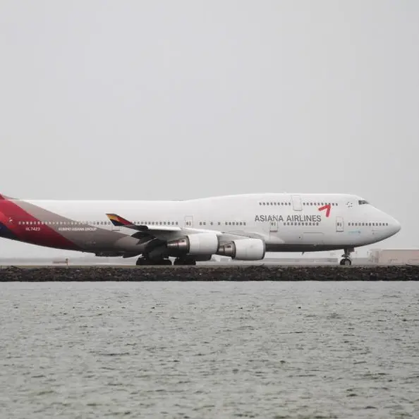 Asiana plane lands safely after door opens during flight -spokesperson