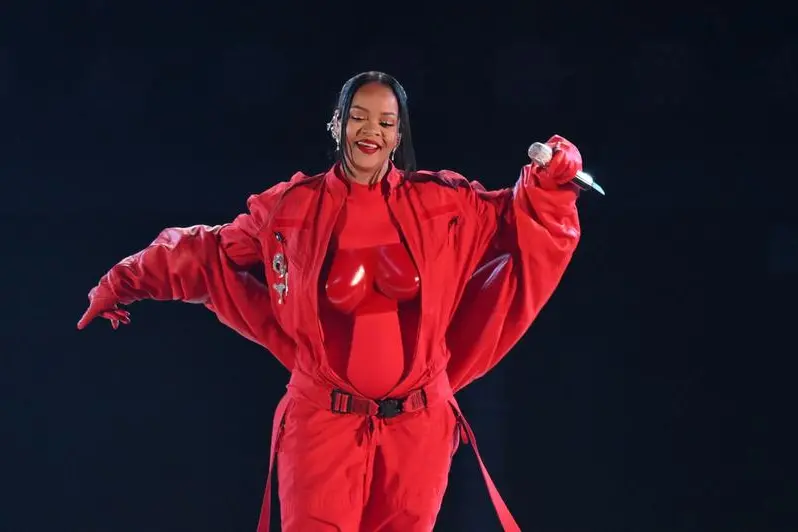 (FILES) In this file photo taken on February 12, 2023 Barbadian singer Rihanna performs during the halftime show of Super Bowl LVII between the Kansas City Chiefs and the Philadelphia Eagles at State Farm Stadium in Glendale, Arizona. - Pop superstar Rihanna will perform at the Oscars next month, organizers said February 23, 2023, just weeks after she made her long-awaited -- and visibly pregnant -- return at the Super Bowl. (Photo by ANGELA WEISS / AFP) , Agence France-Presse (AFP)/AFP