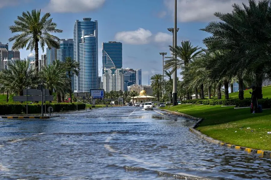 TOPSHOT - A picture shows a flooded street following heavy rains in Sharjah on April 17, 2024. Dubai, the Middle East's financial centre, has been paralysed by the torrential rain that caused floods across the UAE and Bahrain and left 18 dead in Oman on April 14 and 15. (Photo by Ahmed RAMAZAN / AFP)