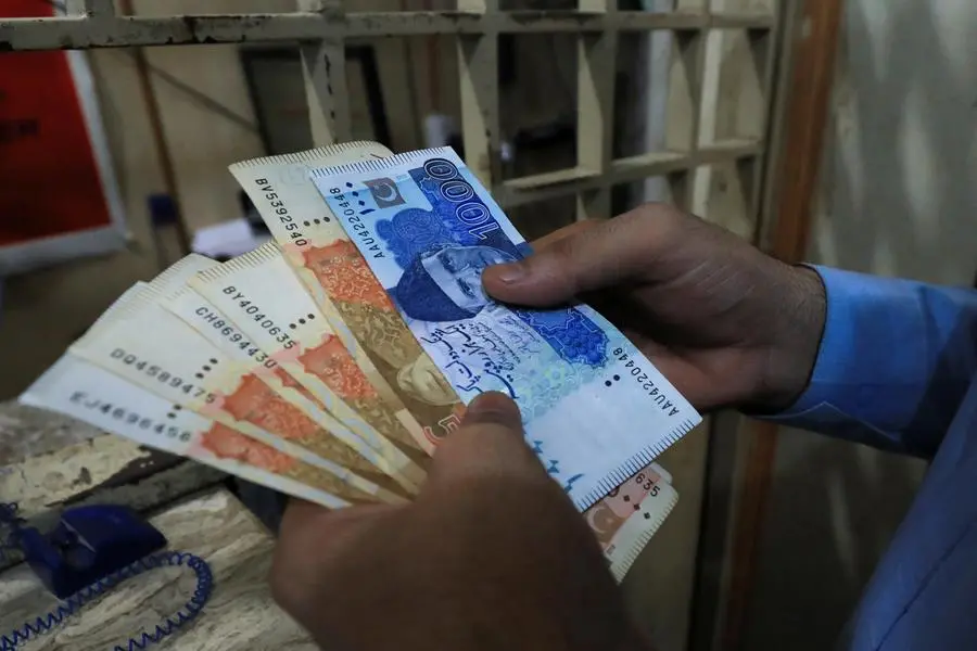 A man counts Pakistani rupee notes at a currency exchange shop in Peshawar, Pakistan September 12, 2023. REUTERS/Fayaz Aziz Image for illustrative purpose. , Reuters/REUTERS