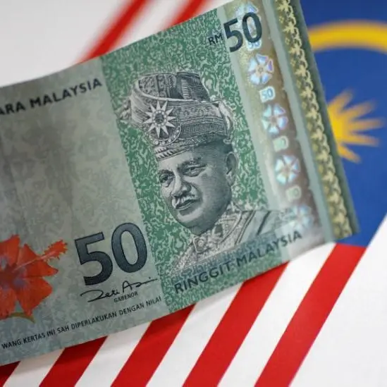 Malaysia c.bank holds rates for third meeting as risks grow