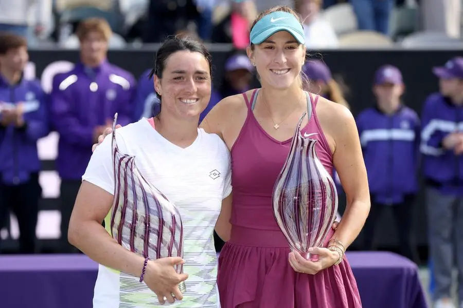 CHARLESTON, SOUTH CAROLINA - APRIL 09: Ons Jabeur of Tunisia and Belinda Bencic of Switzerland pose with their trophies3 during the Finals of the Credit One Charleston Open at Credit One Stadium on April 09, 2023 in Charleston, South Carolina. Matthew Stockman/Getty Images/AFP (Photo by MATTHEW STOCKMAN / GETTY IMAGES NORTH AMERICA / Getty Images via AFP) , Agence France-Presse (AFP)/Getty Images via AFP