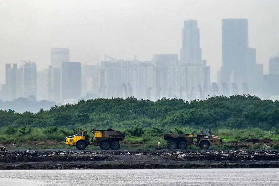 <p>Photo used for illustrative purpose only. This photograph taken on May 26, 2023 shows trucks transporting ash from the incinerated garbage on Pulau Semakau island, which serves as Singapore&#39;s offshore landfill</p>\\n , Agence France-Presse (AFP)/AFP