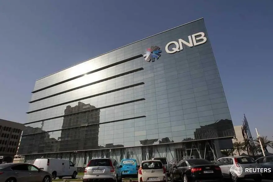 Cars are parked outside the building of Qatar National Bank in Doha. Stringer, Reuters , Reuters Images