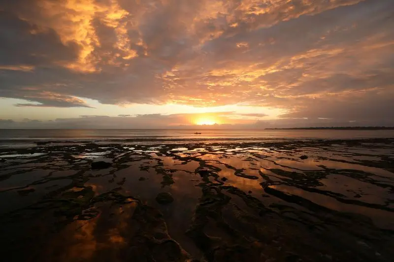 The sun rises as fishermen set out for the day in Pemba, Mozambique, July 10, 2018. Picture taken July 10, 2018. REUTERS/Mike Hutchings TPX IMAGES OF THE DAY - RC1C8E2C89A0 , Reuters Images