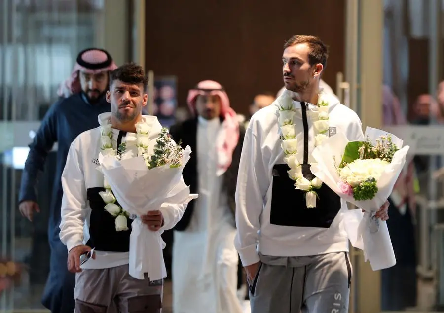 Soccer Football - Paris St Germain arrive in Riyadh ahead of their friendly match v Saudi Pro League XI - King Khalid International Airport, Riyadh, Saudia Arabia - January 19, 2023 Paris St Germain's Juan Bernat and Fabian Ruiz arrive in Saudia Arabia ahead of the match REUTERS/Ahmed Yosri