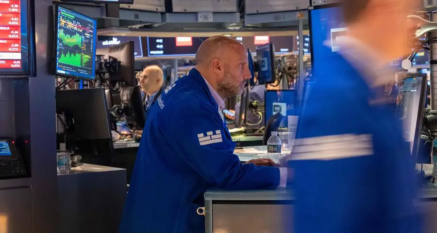 Markets sink, dollar gains as Fed hints at fresh rate hike