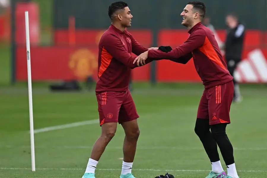 Manchester United\\'s Portuguese defender #20 Diogo Dalot (R) and Manchester United\\'s Brazilian midfielder #18 Casemiro react during a training session at the Carrington Training Complex in Manchester, north-west England on October 23, 2023 ahead of their UEFA Champions League Group A football match against FC Copenhagen. (Photo by Paul ELLIS / AFP) , Agence France-Presse (AFP)/AFP