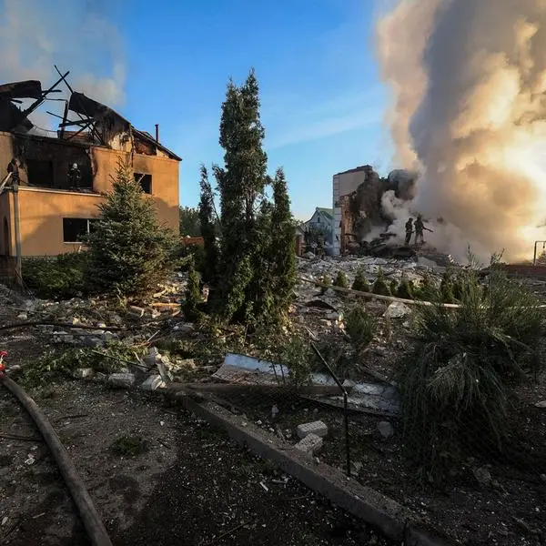 Russian missile strike sets houses ablaze in Ukraine's Kharkiv, officials say
