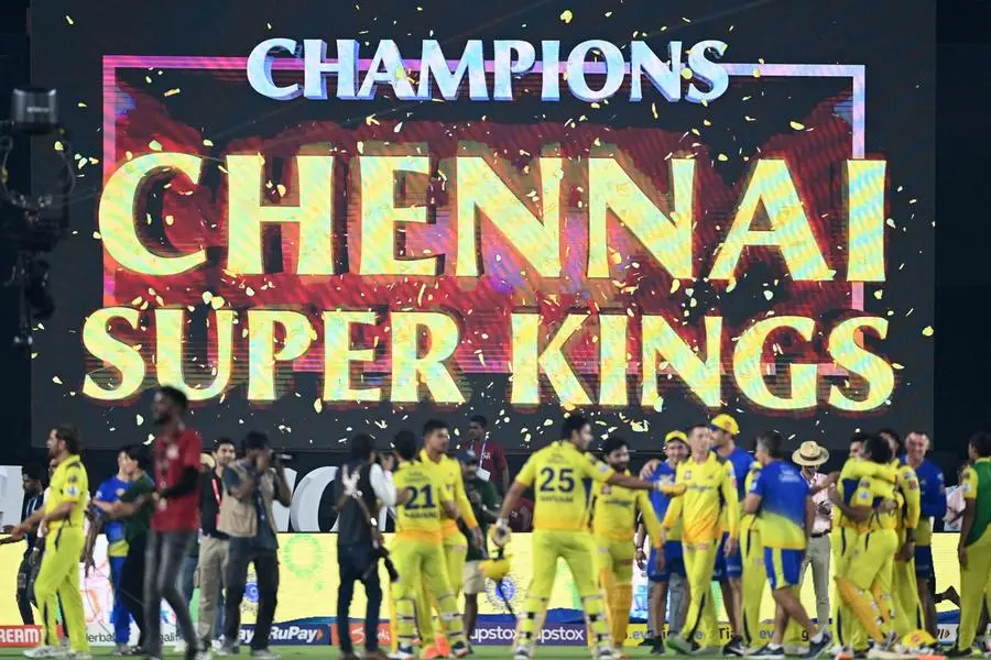 Chennai Super Kings' players celebrate their win at the end of the Indian Premier League (IPL) Twenty20 final cricket match between Gujarat Titans and Chennai Super Kings at the Narendra Modi Stadium in Ahmedabad on May 30, 2023. (Photo by Sajjad HUSSAIN / AFP)