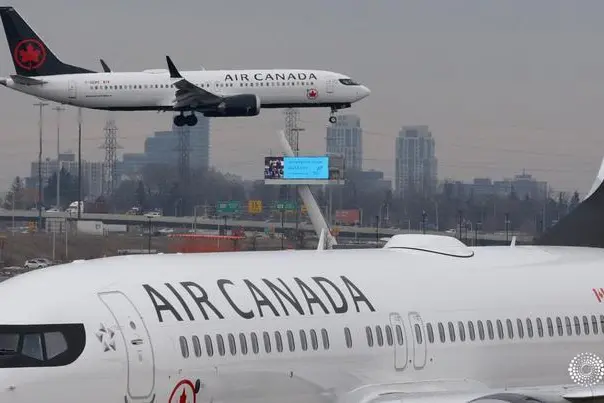An Air Canada Boeing 737 MAX 8 from San Francisco approaches for landing at Toronto Pearson International Airport over a parked Air Canada Boeing 737 MAX 8 aircraft in Toronto, Ontario, Canada, March 13, 2019. Chris Helgren, Reuters Image used for illustrative purpose. , Reuters Images