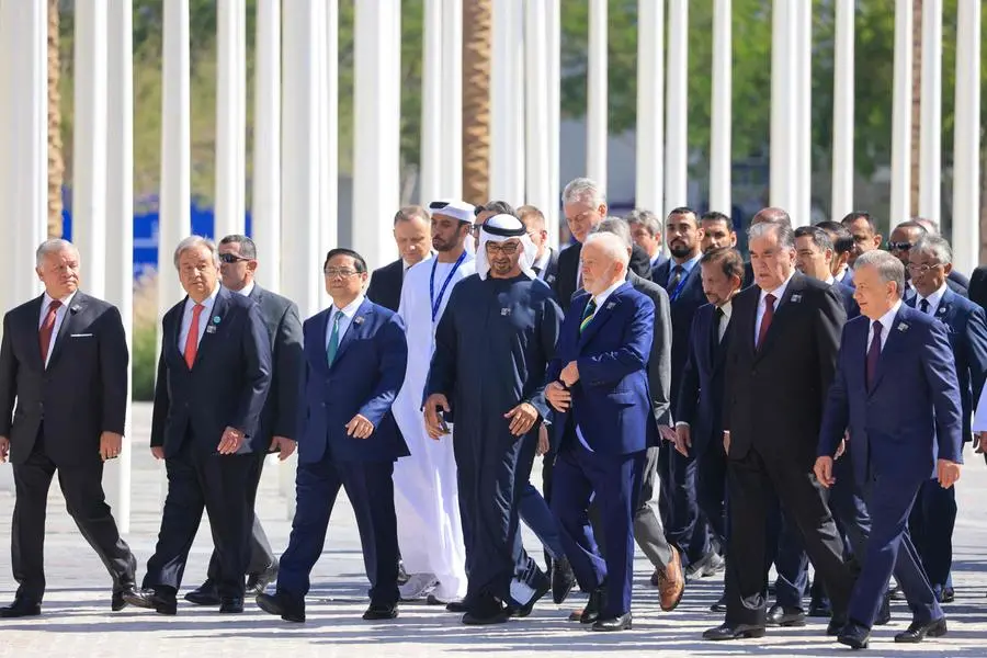 Participating world leaders and delegates leave after posing for a family photo during the COP28 United Nations climate summit in Dubai on December 1, 2023. World leaders take centre stage at UN climate talks in Dubai on December 1, under pressure to step up efforts to limit global warming as the Israel-Hamas conflict casts a shadow over the summit. (Photo by KARIM SAHIB / AFP) , Agence France-Presse (AFP)/AFP