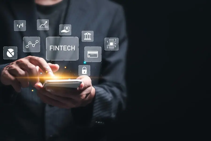 Fintech (financial technology) and digital money concept. Businessman use mobile smart phone with digital finance icons for digital banking, internet payment, online shopping, financial technology. Image used for illustrative purpose. Getty Images , Getty Images