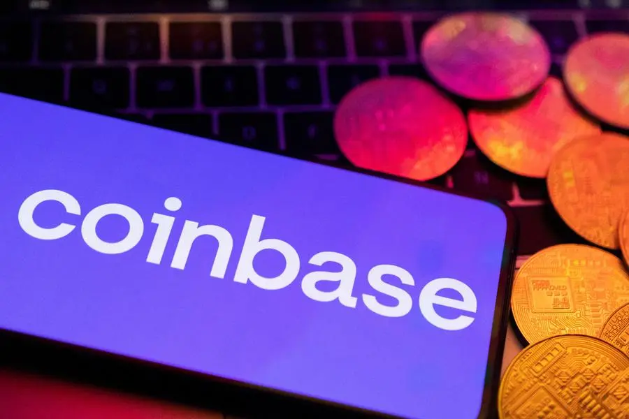 A smartphone with displayed Coinbase logo and representation of cryptocurrencies are placed on a keyboard in this illustration taken, June 8, 2023. REUTERS/Dado Ruvic/Illustration , Reuters/REUTERS