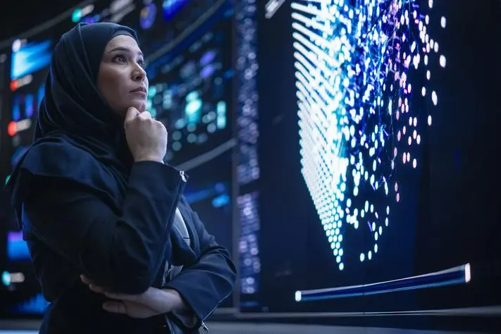 Portrait of a Smart Focused Middle Eastern Software Engineer Analyzing Neural Network Big Data on a Digital Screen. Young Arab Woman in Hijab Working in an Innovative Internet Service Company. Image used for illustrative purpose. Getty Images , Getty Images