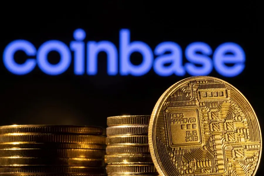 FILE PHOTO: A representation of the cryptocurrency is seen in front of Coinbase logo in this illustration taken, March 4, 2022. REUTERS/Dado Ruvic/Illustration/File Photo , Reuters