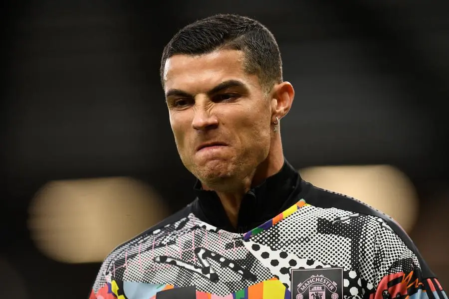 (FILES) In this file photo taken on October 30, 2022 Manchester United\\'s Portuguese striker Cristiano Ronaldo gestures as he warm up ahead of the English Premier League football match between Manchester United and West Ham United at Old Trafford in Manchester, northwest England. - Manchester United said on November 14, 2022 they were \"considering their response\" to an interview given by star forward Cristiano Ronaldo where he said he felt \"betrayed\" by the club. (Photo by Oli SCARFF / AFP)