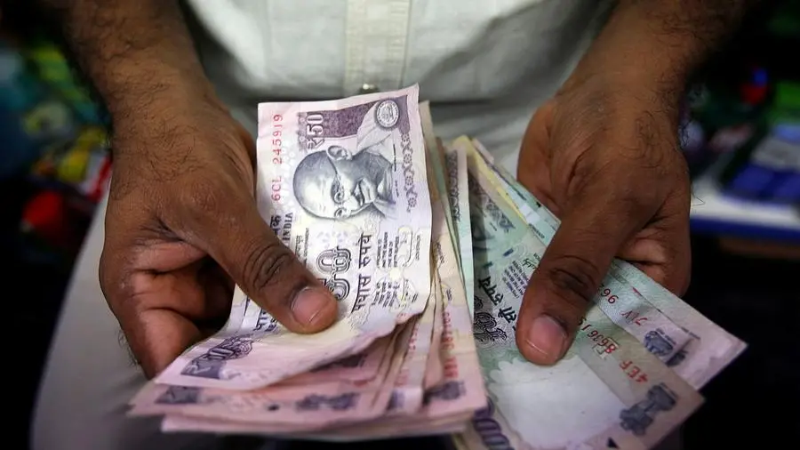 Indian rupee ends flat, forward premiums tick up as focus turns to US economic data