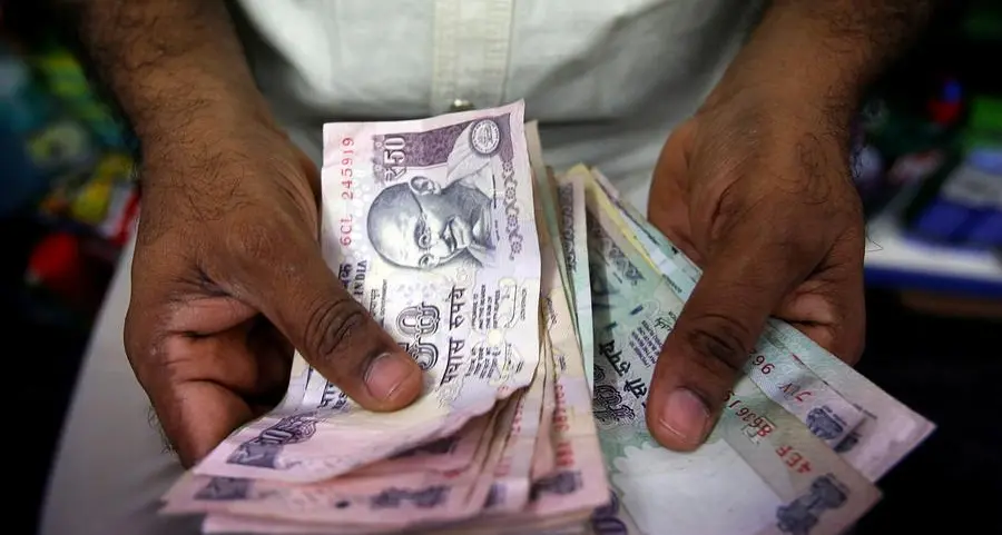 Indian rupee ends flat as state-run banks' dollar sales offset fall in Asian peers