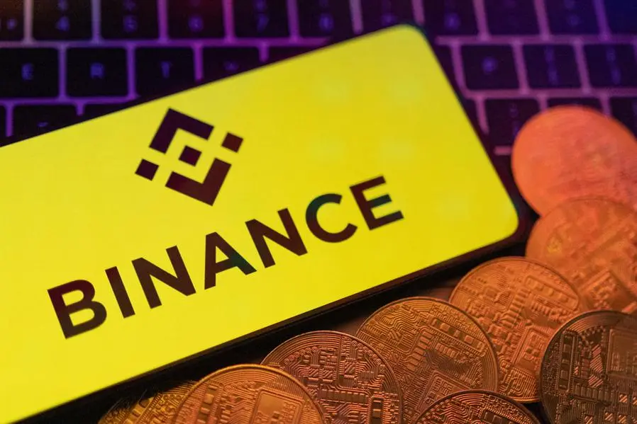 Smartphone with displayed Binance logo and representation of cryptocurrencies are placed on a keyboard in this illustration taken, June 8, 2023. REUTERS/Dado Ruvic/Illustration , Reuters